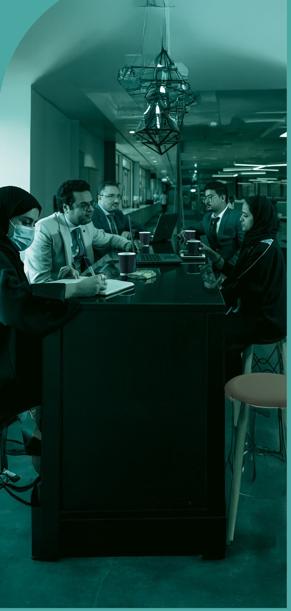 Jamjoom team members in a collaborative meeting environment.